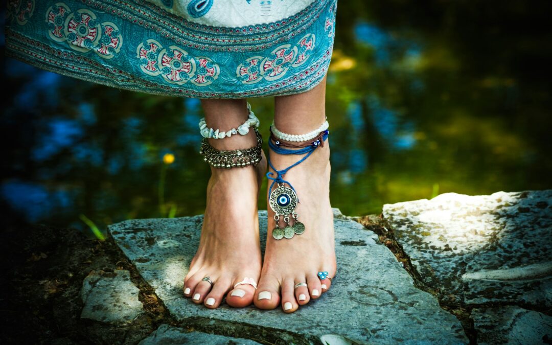 barefoot woman stand boho fashion style with jewellery outdoor