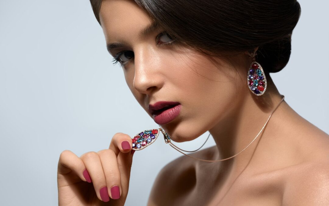 Gorgeous woman with precious jewelry in studio