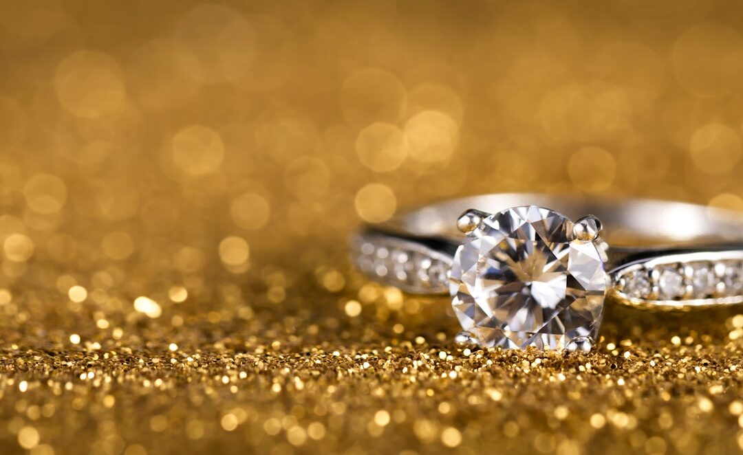 Selective focus closeup of a diamond ring on a gold background